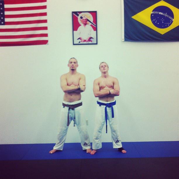 Chasen Hill receiving his Brazilian Jiu Jitsu blue belt with his coach in 2012