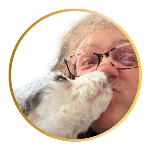 Birdi Sinclair and dog licking face