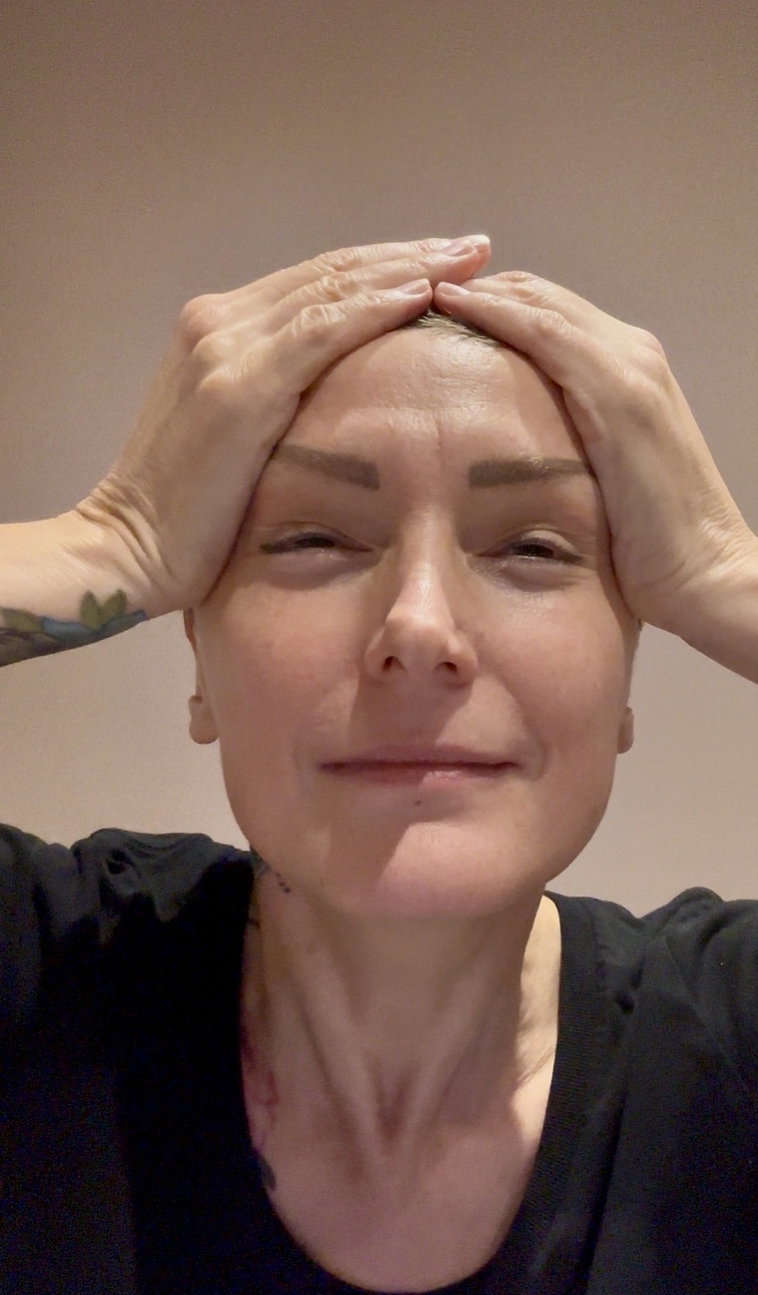 Sarah demonstrating face yoga