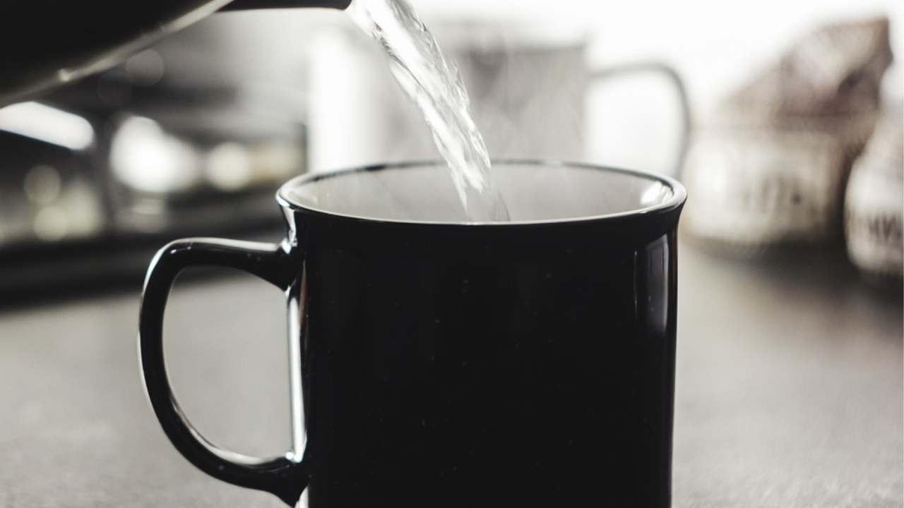 hot water being poured from kettle