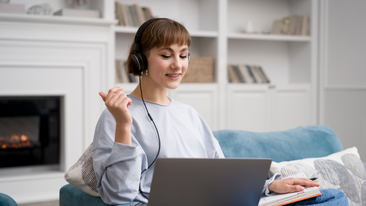 woman looking at laptop and smiling