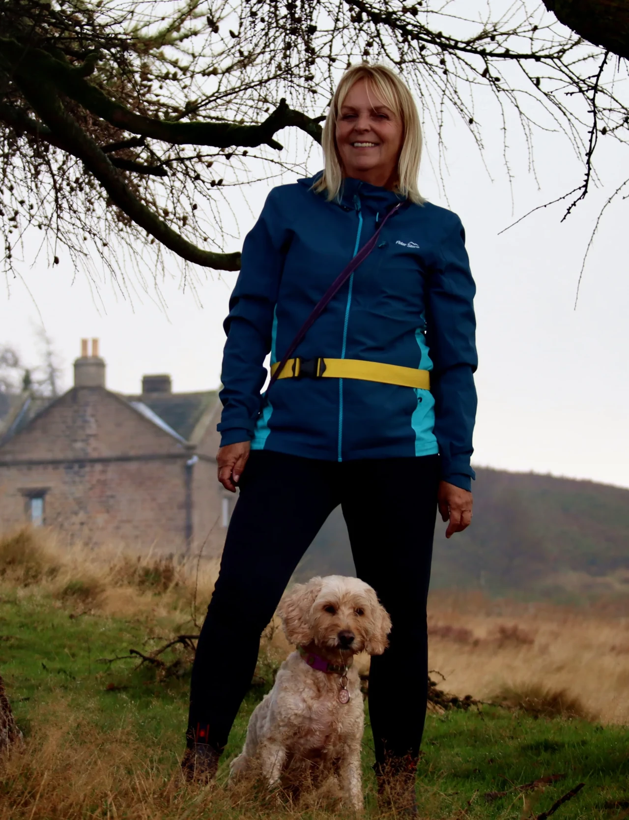 Victoria standing with Cockerpoo Daisy