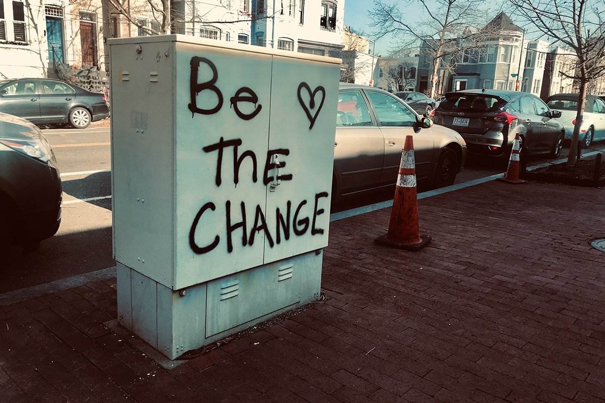 A street scene with be the change graffit
