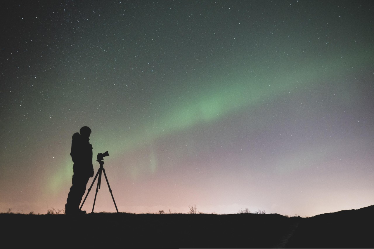 aurora borealis and photographer