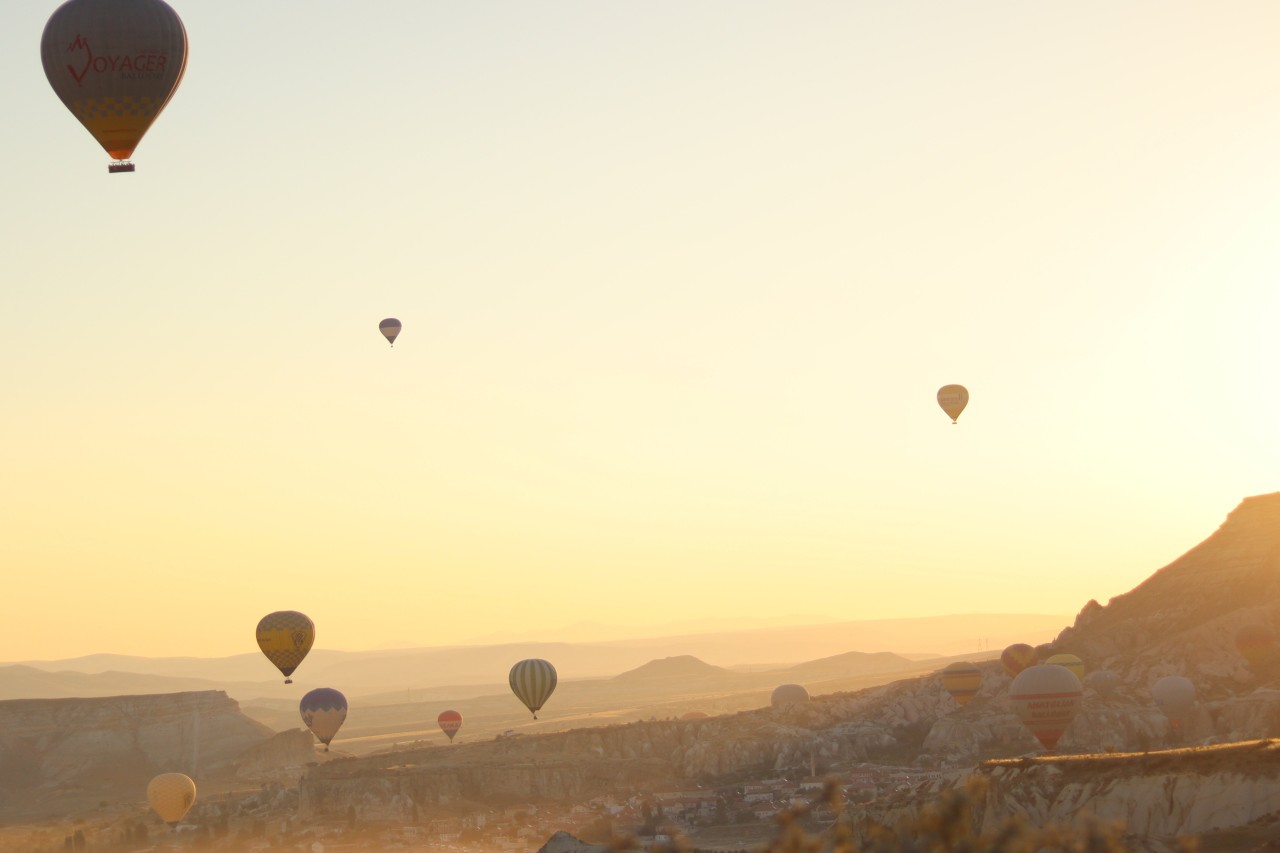 hot air balloons in golden sky