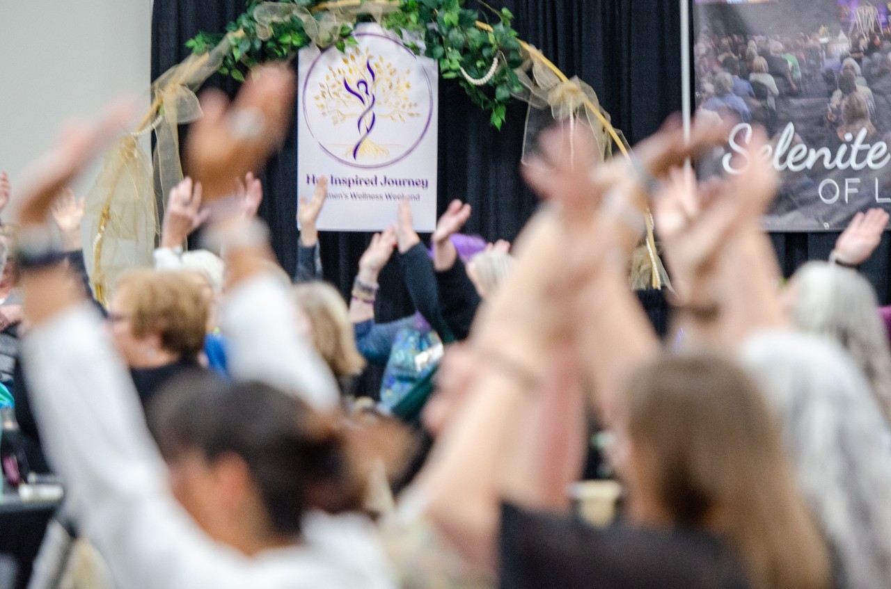 Women gathering and connecting at Her Inspired Journey