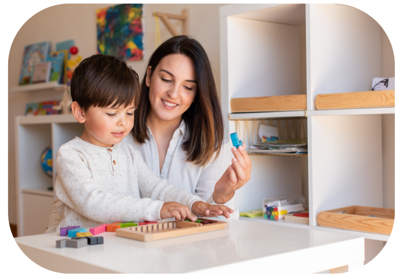 Play therapist with young client in a layroom