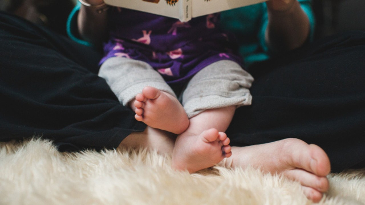 Baby and adult feet