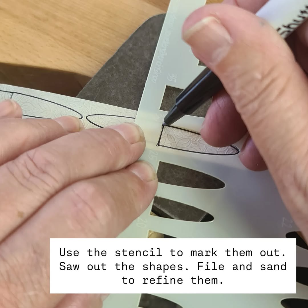 Use the stencil to mark them out. Saw out the shapes. File and sand to refine them.