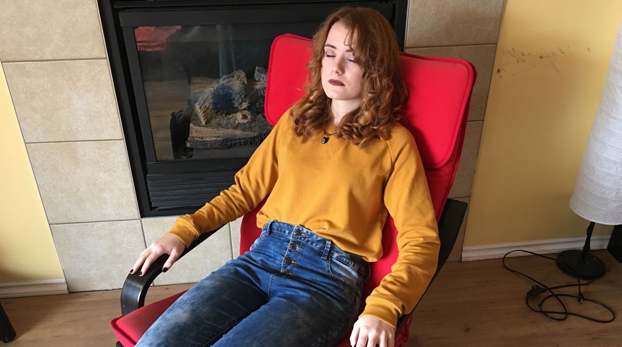 Mira meditating on a chair.