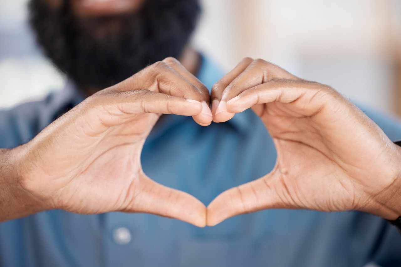 Man making a heart with his hands