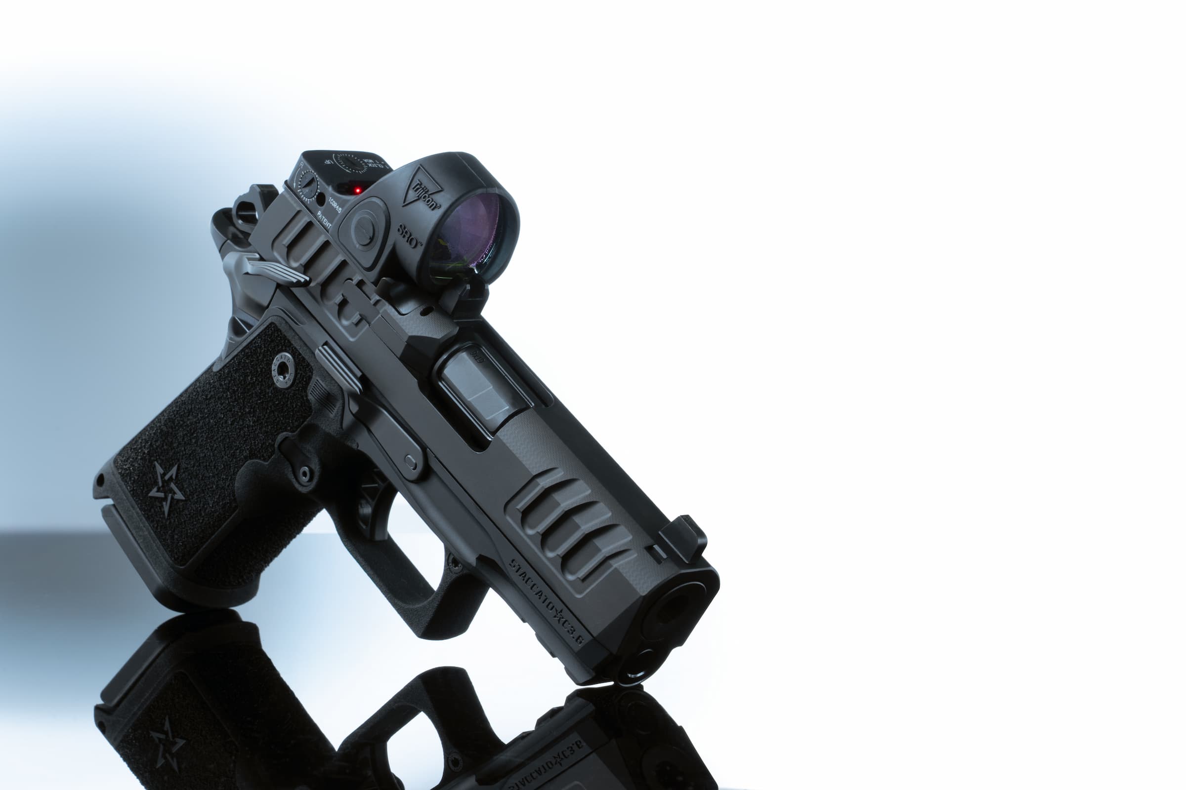 A Staccato 2011 with a red dot mounted on the milled slide