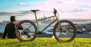 MAn sat with his bike looking over the city