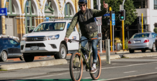 MAn riding his bike on the road
