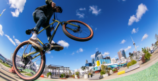 man riding a bike in a skate park