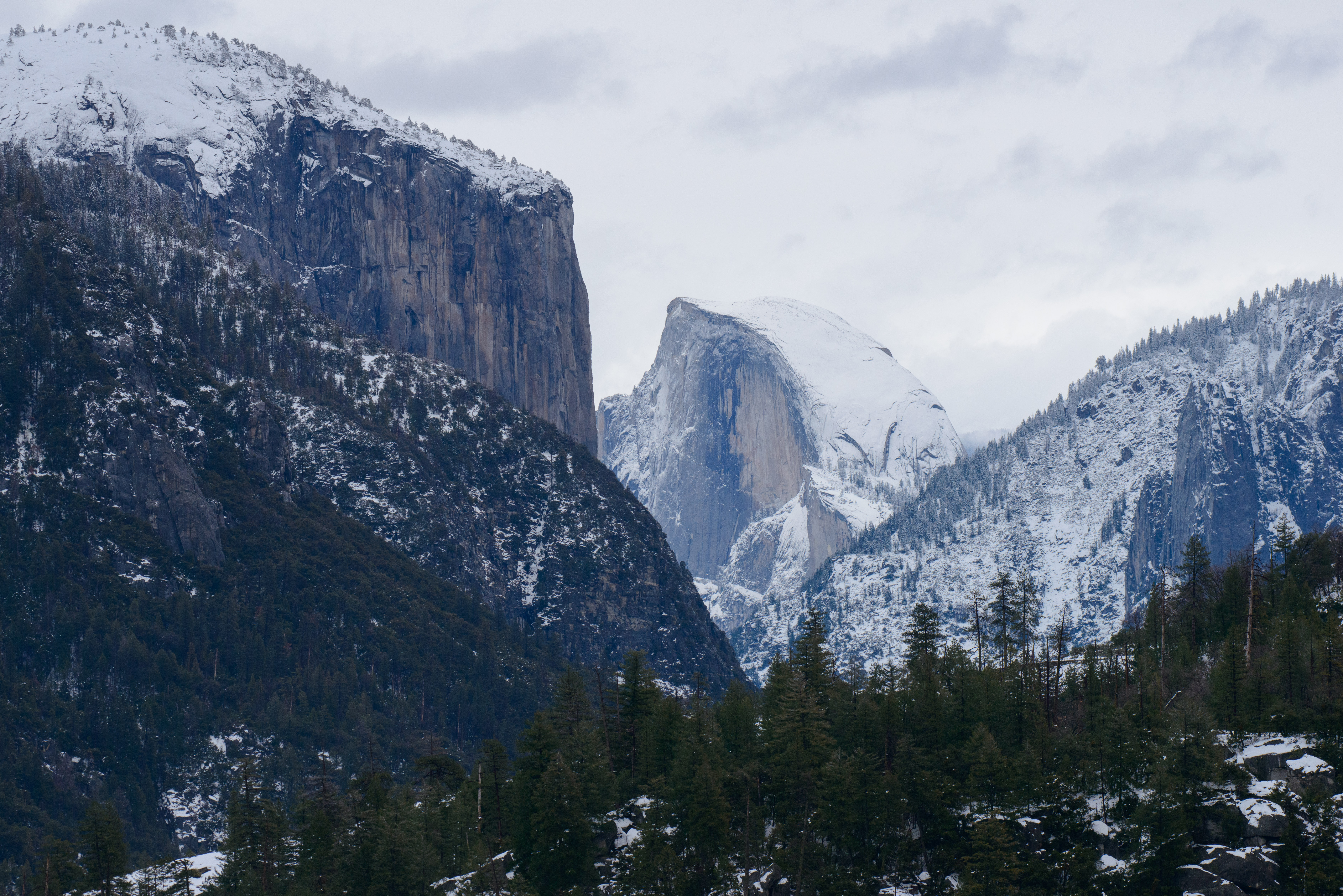 half dome and el capitan after a snowstorm