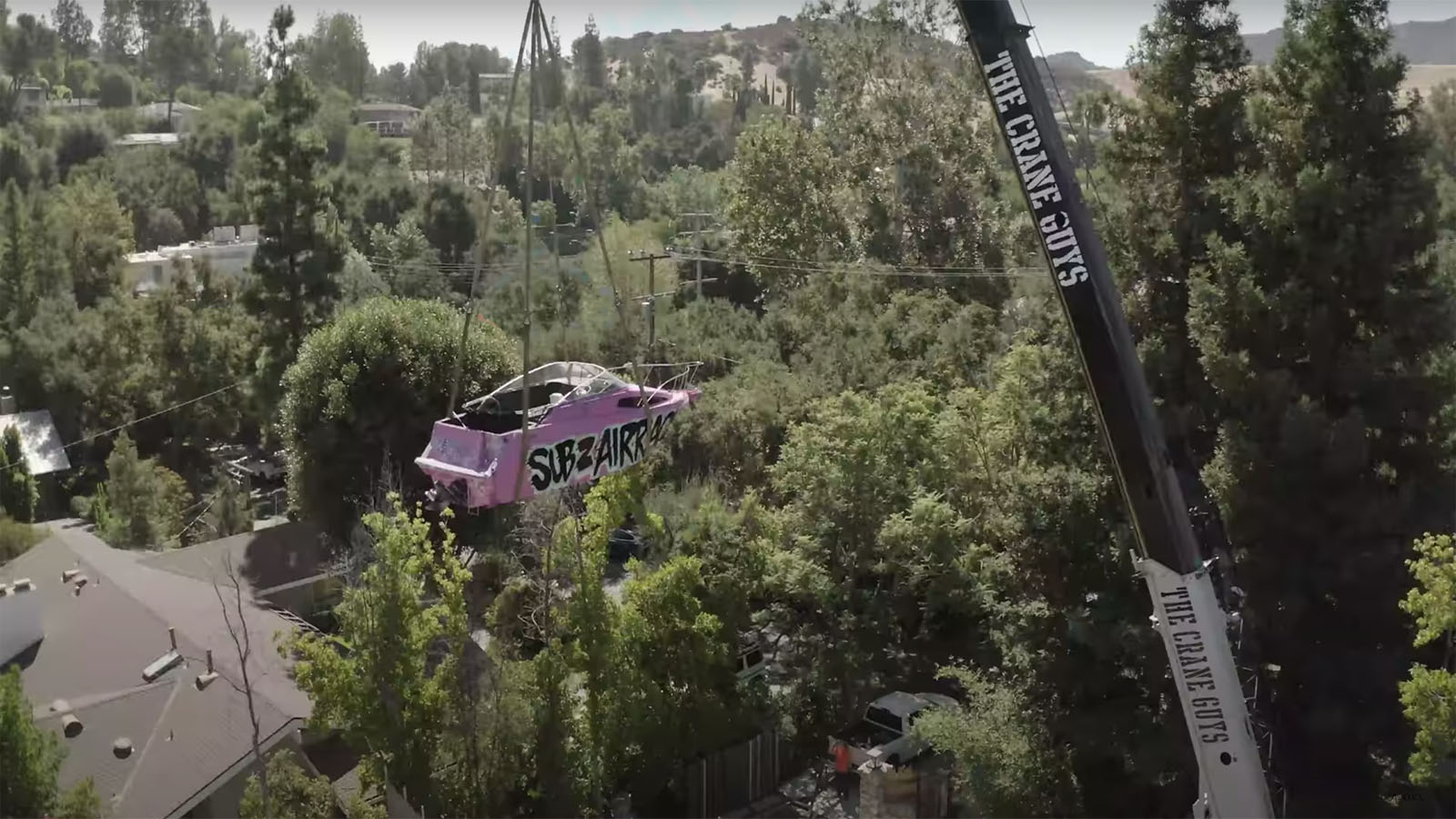 Airrack lifts pink yacht over Logan Paul's house