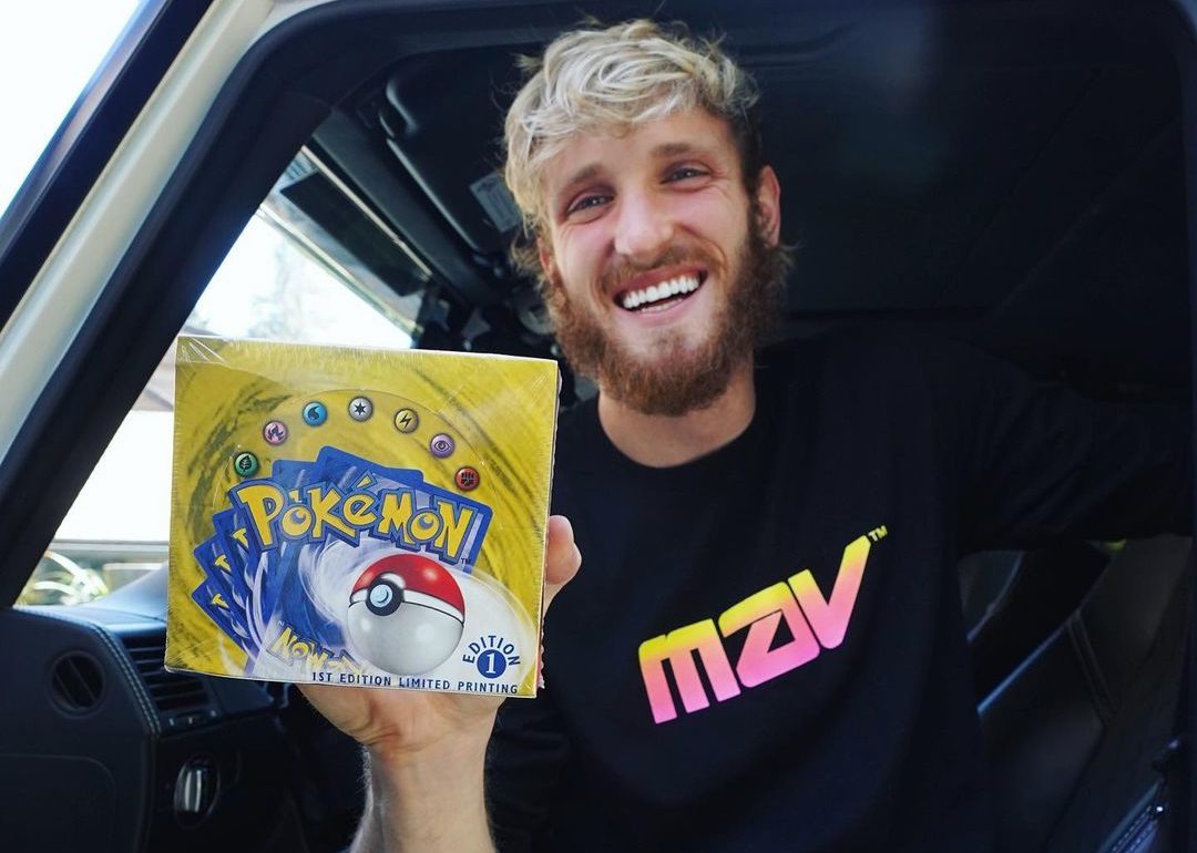 logan paul with pokemon trading card 200k base set