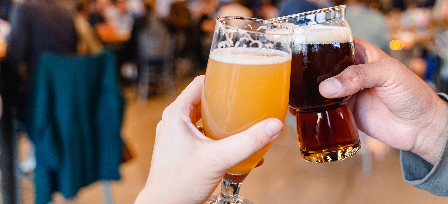 A woman scrolling the Discover Durham app on her phone