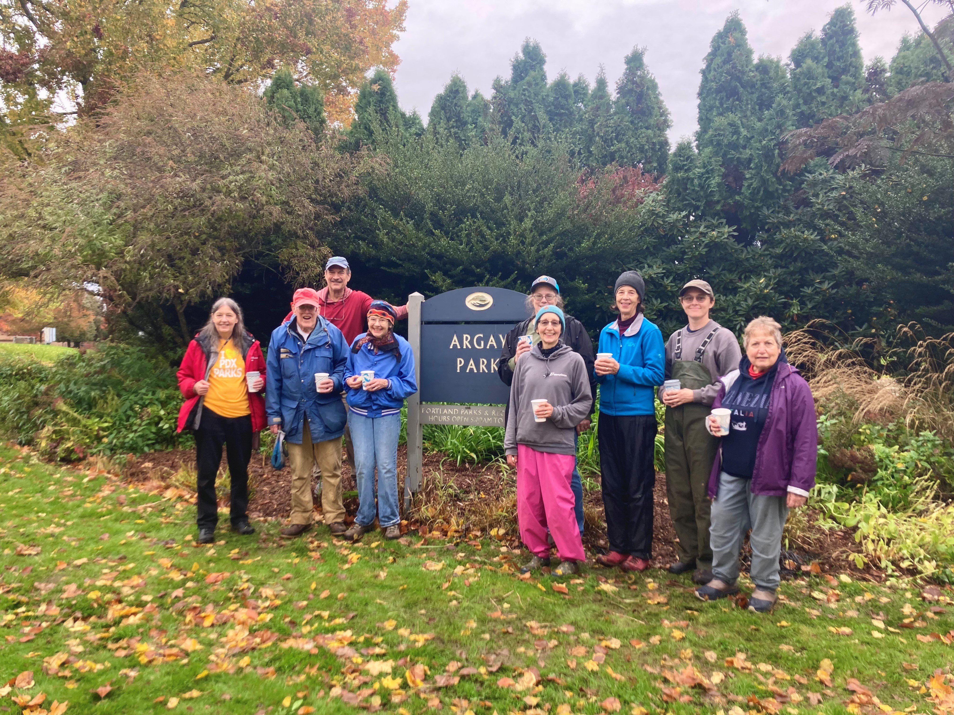argay park volunteers in front of the sign bed