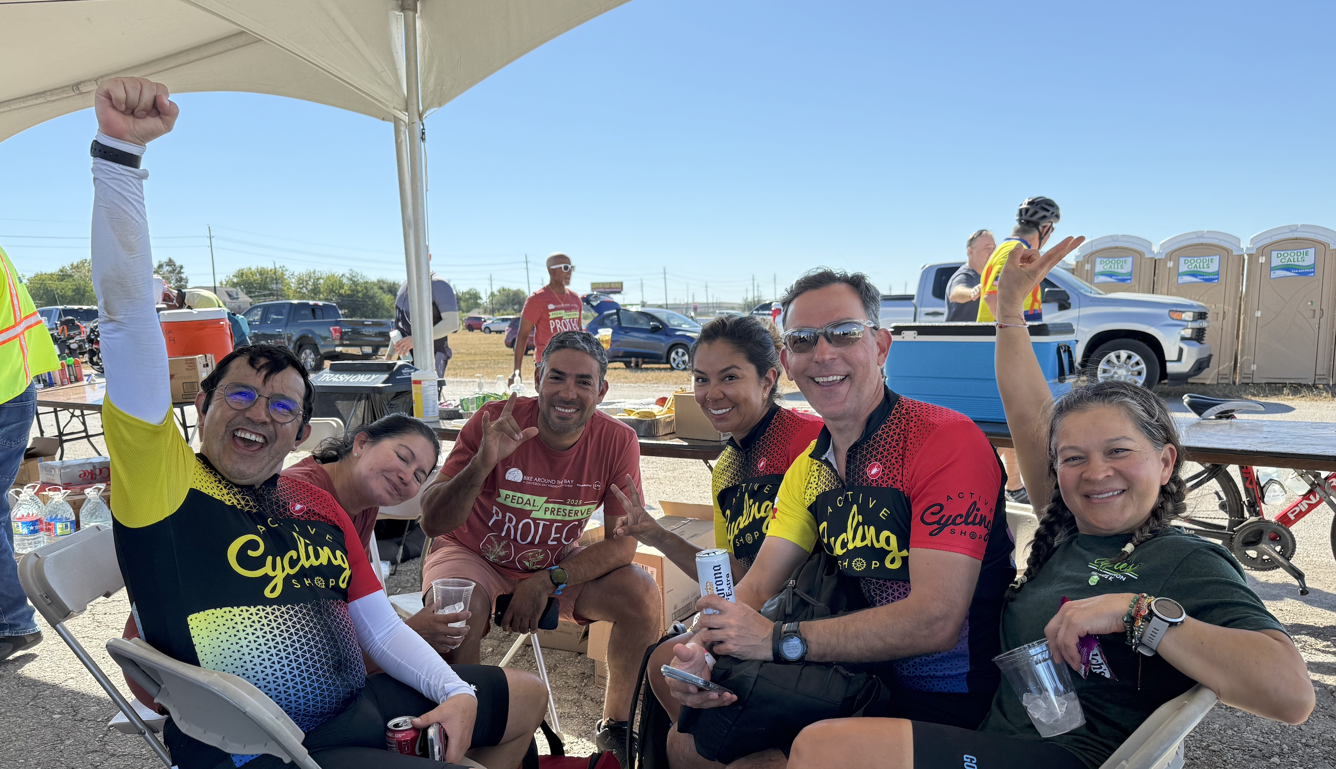 Bike Around the Bay riders and volunteers at the event finish