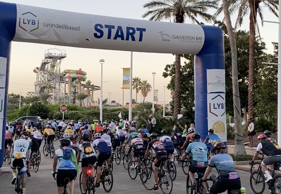 Bike Around the Bay riders and volunteers at the event finish
