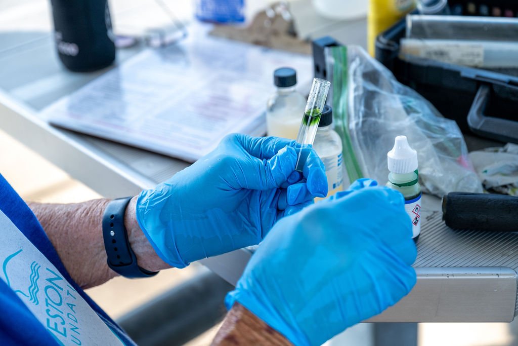 Volunteers collecting water samples in Galveston Bay