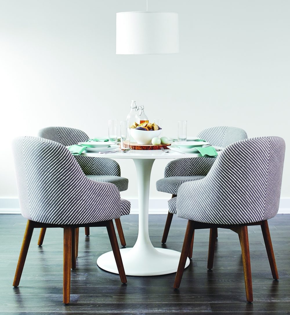 Family dinner should be a relaxed affair. Creating the right setting helps. Chairs with arms and cushioning are more comfortable than solid wood or metal chairs, so they encourage family members to linger.