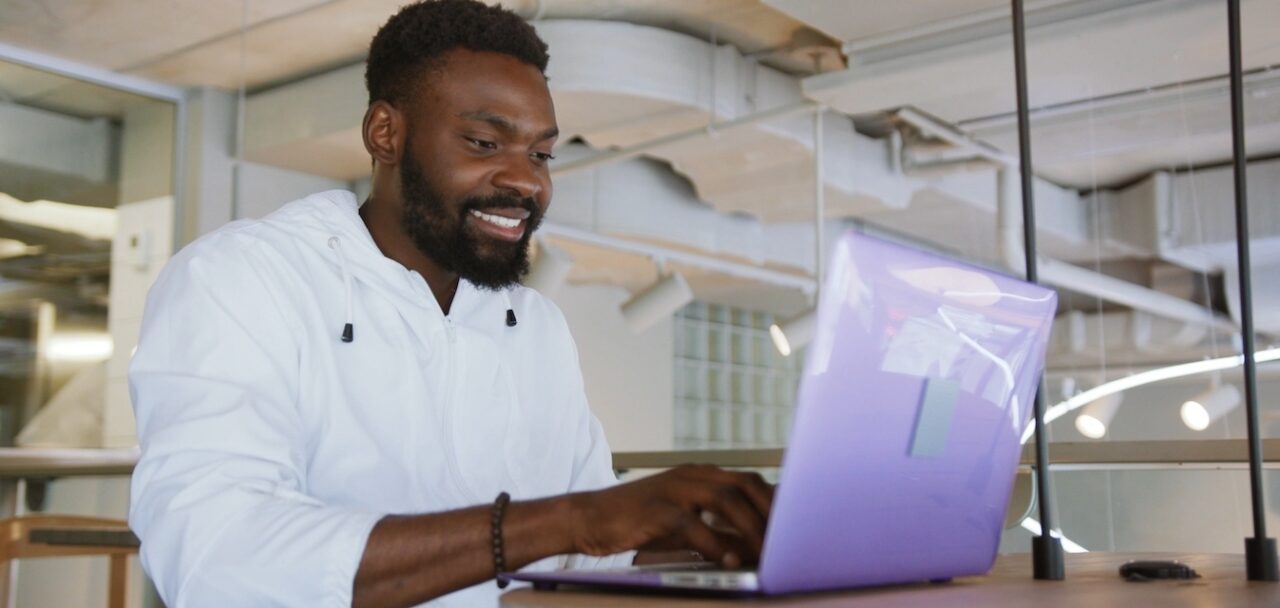 Man coding in start up space