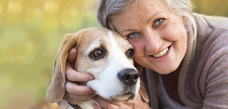 woman and her dog smiling