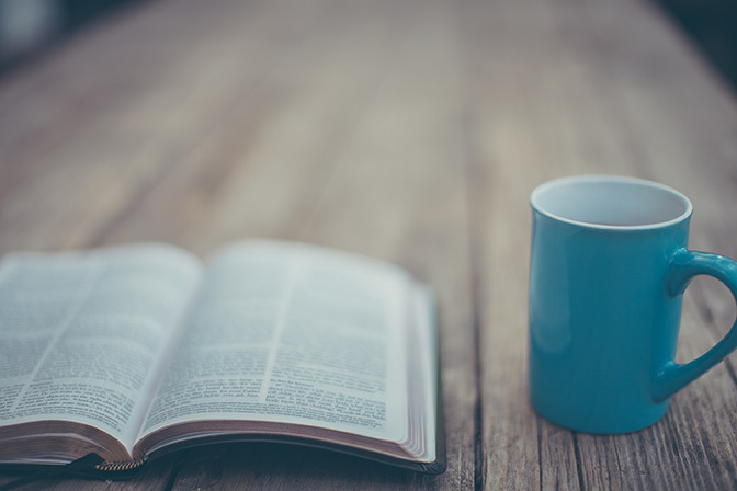 Stock open bible and coffee mug