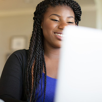 Woman looking at computer screen 400x400