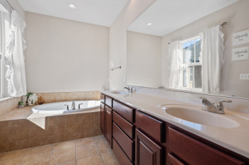Refreshing window over jetted tub w/tile surround