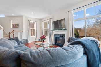 Get cozy by the Fireplace & gaze out the windows