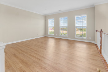 Unfurnished room featuring light hardwood / wood-style flooring and ornamental molding