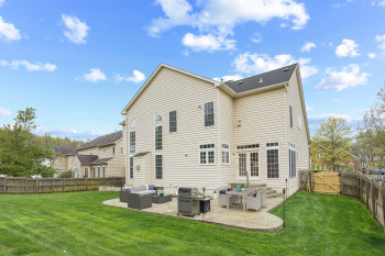 Rear view of property featuring a patio area, outdoor lounge area, and a yard