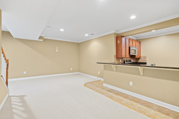 Interior space featuring light carpet and ornamental molding