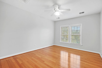 Unfurnished room featuring light hardwood / wood-style flooring and ceiling fan