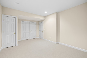 Unfurnished bedroom featuring light carpet