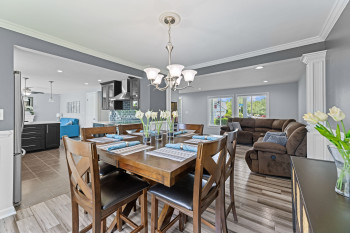 Dining space/Hardwood floors/beautiful wainscoting