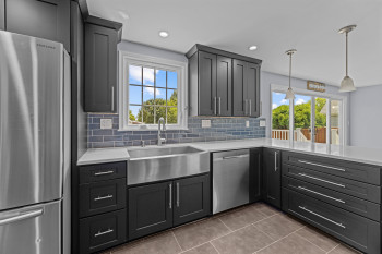 Kitchen includes a 36” deep stainless steel farmhouse sink
