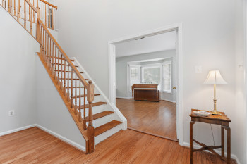 Stairs with hardwood / wood-style flooring