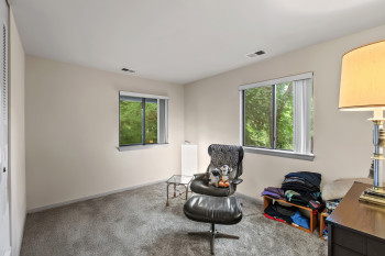 Sitting room featuring carpet floors and baseboards