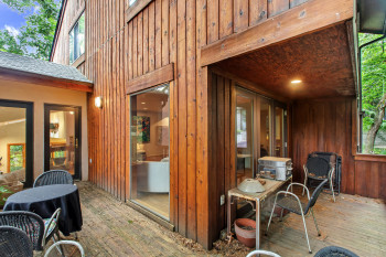 View of patio with a wooden deck