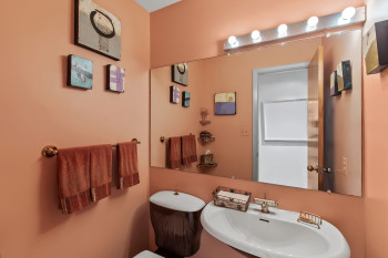 Half bathroom with a sink and toilet