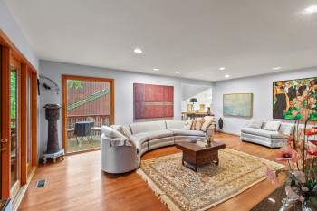 Living area featuring plenty of natural light, light wood-style floors, and recessed lighting