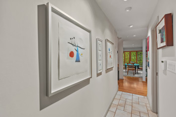 Hall with recessed lighting and light tile patterned floors