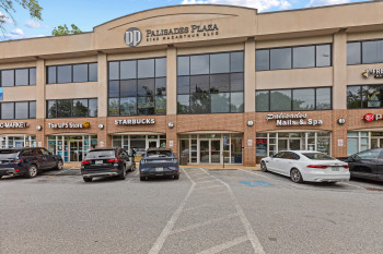 View of commercial location with uncovered parking