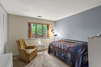 Bedroom with carpet floors and baseboards