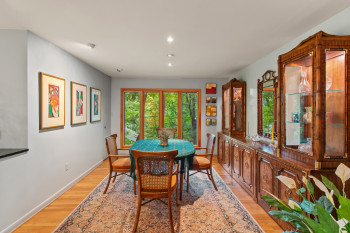 Dining space with recessed lighting and light wood-type flooring